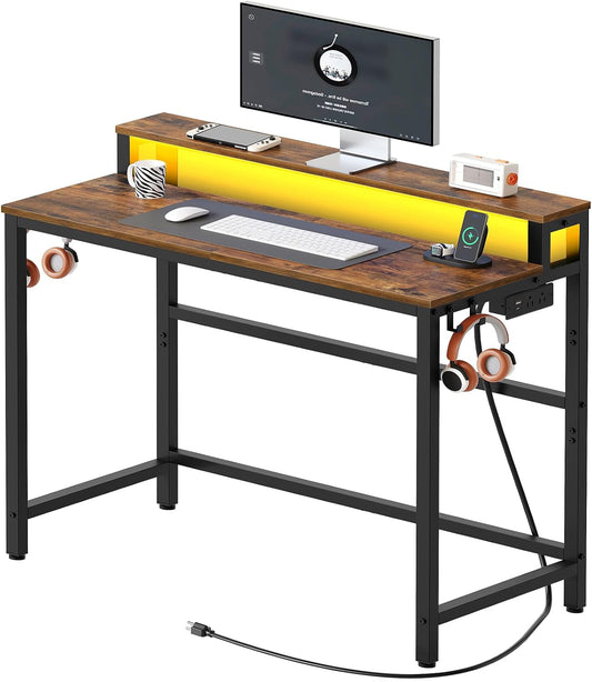 YATINEY Small Computer Desk with Charging Station and LED Lights, Gaming Desk with Monitor Stand, 2-Tier Home Office Desk with 4 Side Hooks, for Living Room, Home Office, Rustic Brown DN01UDBRY2
