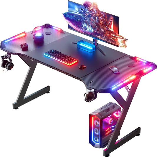 HLDIRECT 47 Inch Gaming Desk with LED Lights, Ergonomic Computer Gaming Table with Carbon Fibre Surface, Sturdy PC Workstation Desk for Home Office with Headphone Hook, Cup Holder, Black