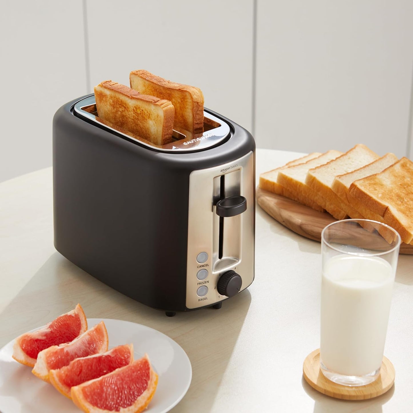 Amazon Basics 2 Slice Toaster, Extra Wide Slots for Bagels, 6 Browning Settings, Removable Crumb Tray, Defrost/Cancel/Bagel Buttons, Cord Wrap, 900W, Black & Silver